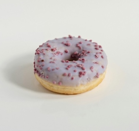Lavender glazed donut with berry crumble topping.
